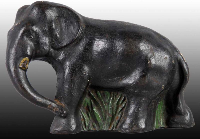 Appraisal: Elephant in Grass Cast Iron Doorstop Description Marked and numbered