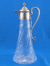 Appraisal: A silver mounted glass claret jug the body very finely