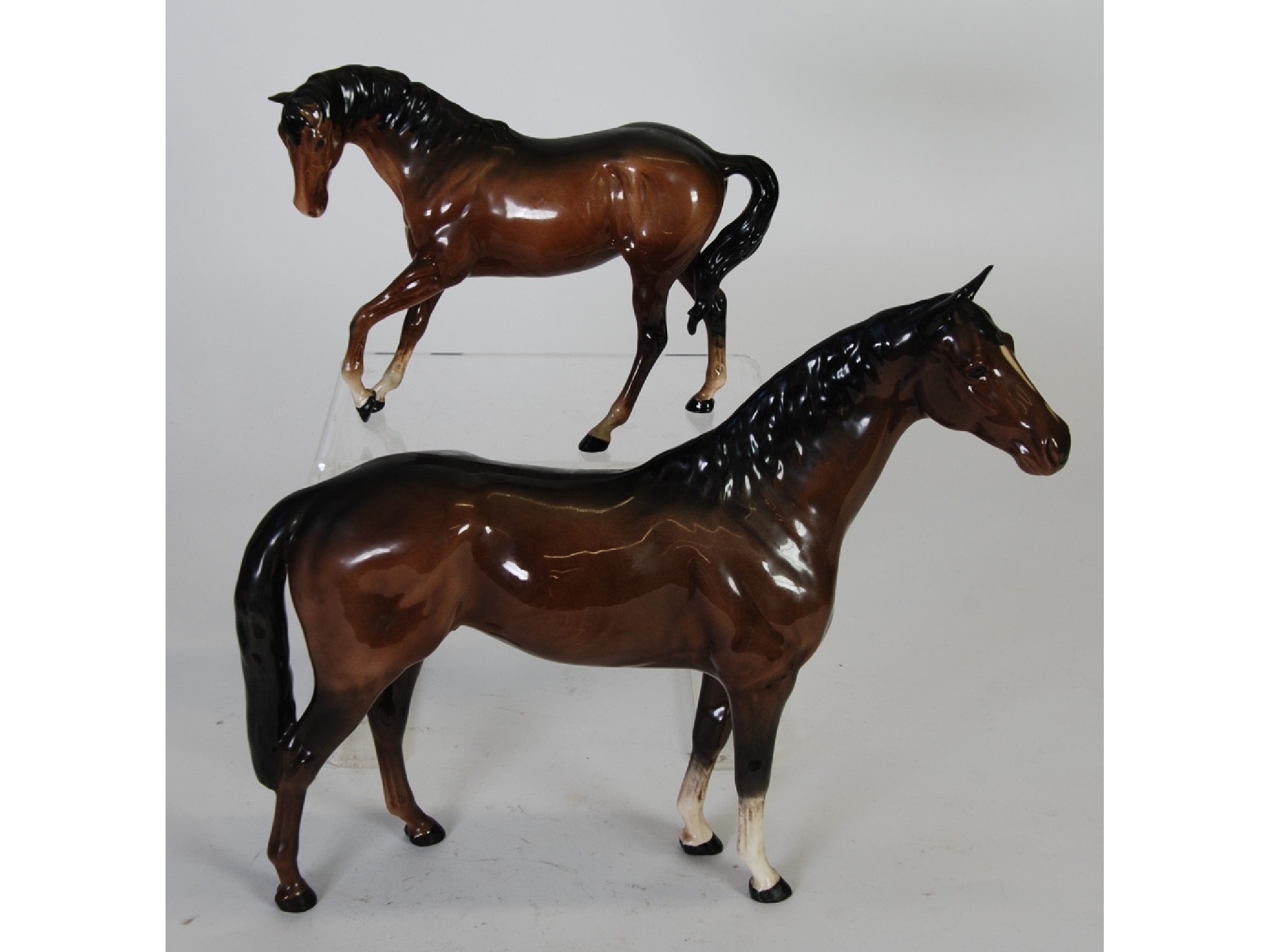 Appraisal: TWO BESWICK BROWN GLOSS POTTERY MODELS OF HORSES comprising LARGE