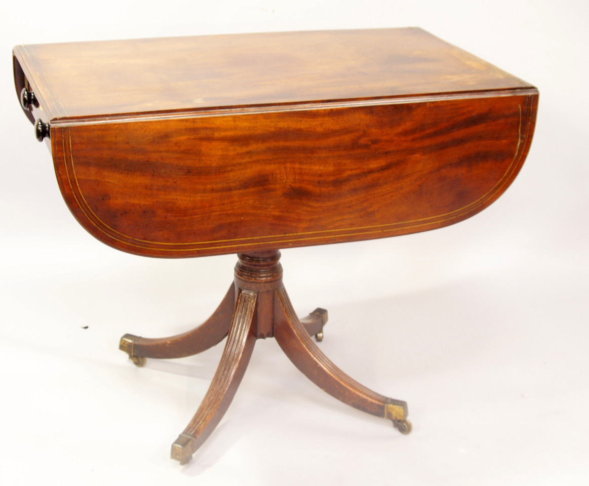 Appraisal: A Regency figured mahogany Pembroke table with brass inlaid rounded