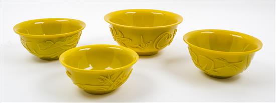 Appraisal: Sale Lot Four Yellow Peking Glass Bowls each depicting flowering