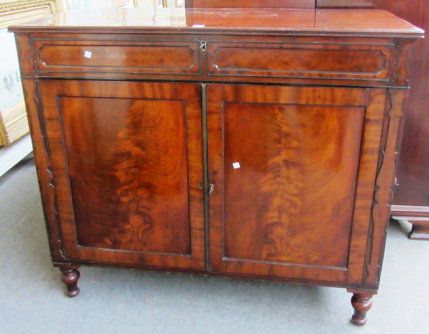 Appraisal: A Regency mahogany side cabinet with single frieze drawer above