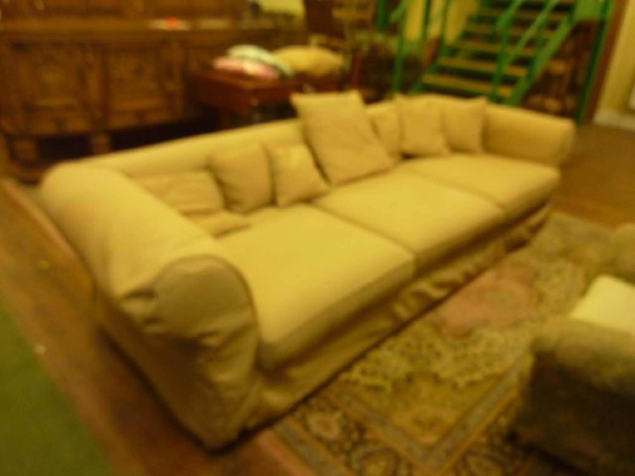 Appraisal: An exceptionally large sofa in the Chesterfield style with rolled