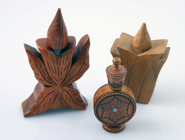 Appraisal: Two Hawaii mahogany Pikake bottles by John Oya and a