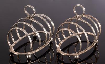 Appraisal: A pair of silver toast racks Goldsmiths Silversmiths Co Ltd