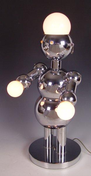 Appraisal: TORINO POLISHED CHROME FIGURAL ROBOT LAMP Mid century Italian lamp