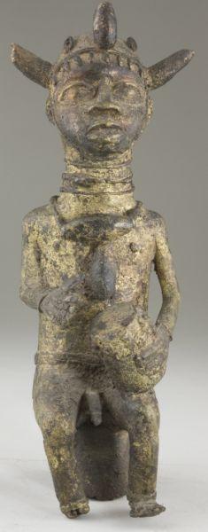 Appraisal: West African Gilt Bronze Statuette Benin depicts a seated man