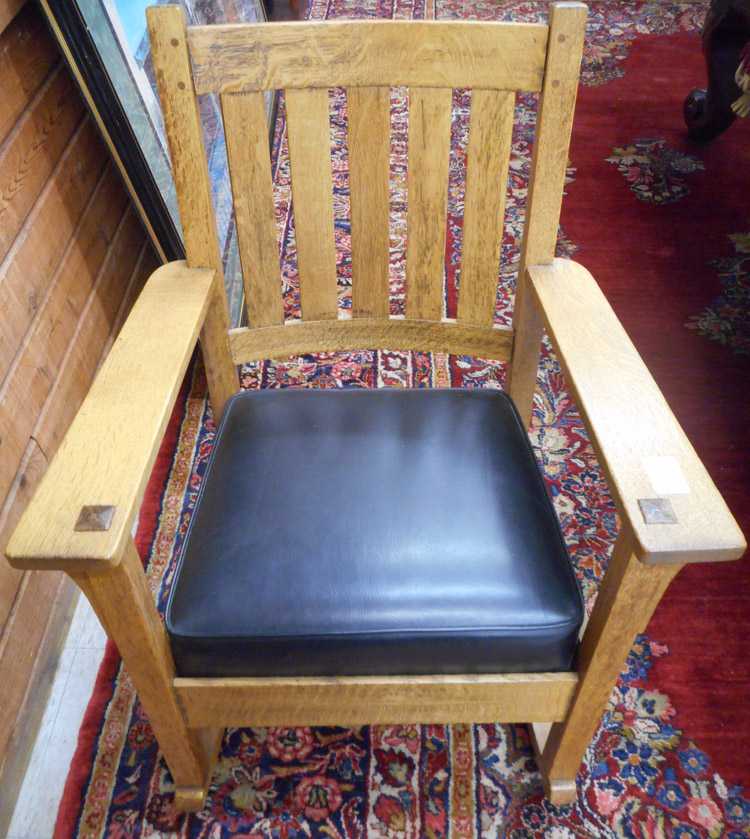 Appraisal: CHARLES STICKLEY CRAFTSMAN OAK ROCKING CHAIR Charles Stickley branded trademark