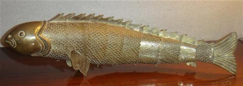 Appraisal: GROUP OF DECORATIVE TABLE WARES Including a brass mantle-top fish