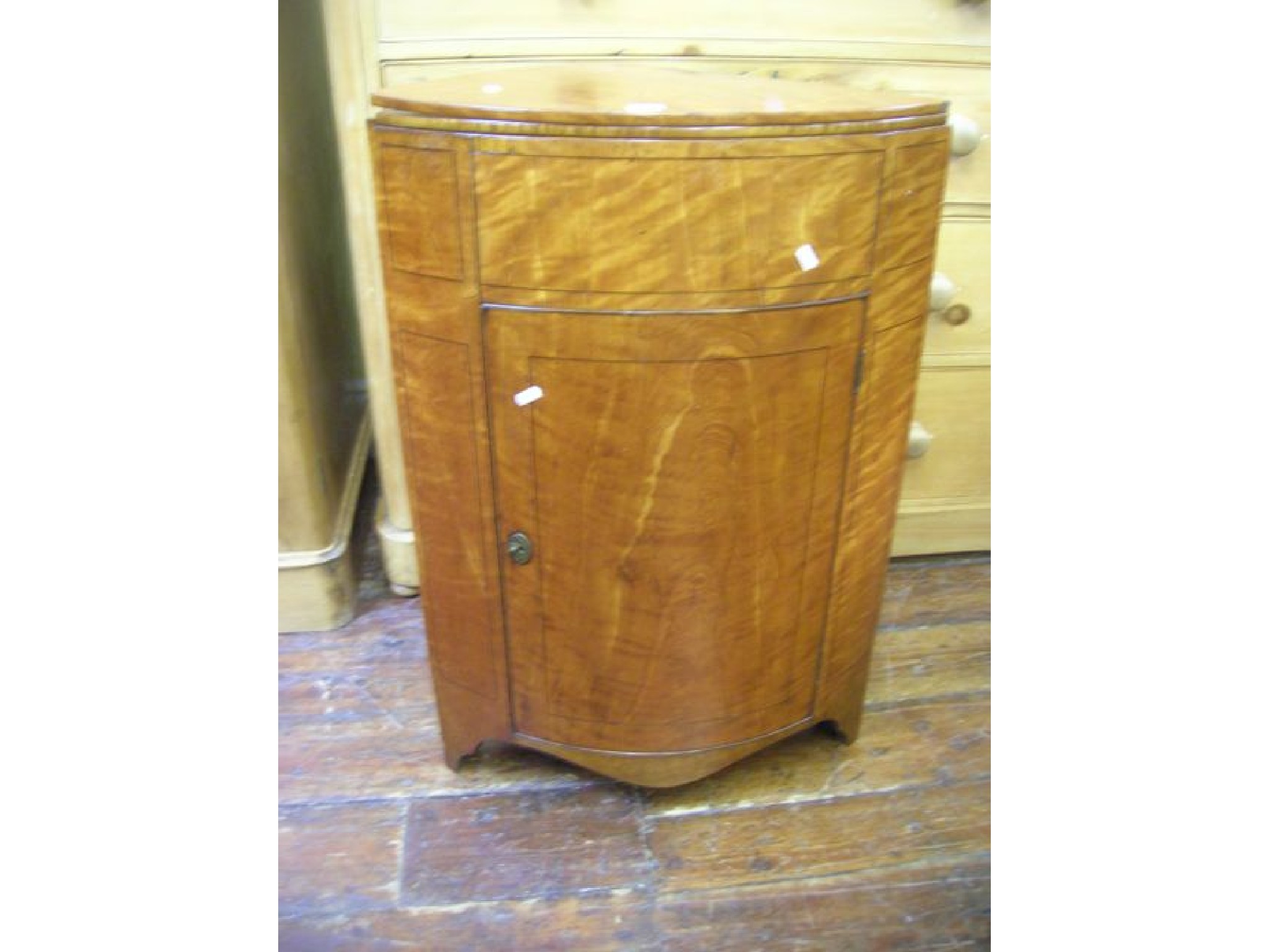 Appraisal: A Beidermeier corner washstand with bow fronted outline enclosed by