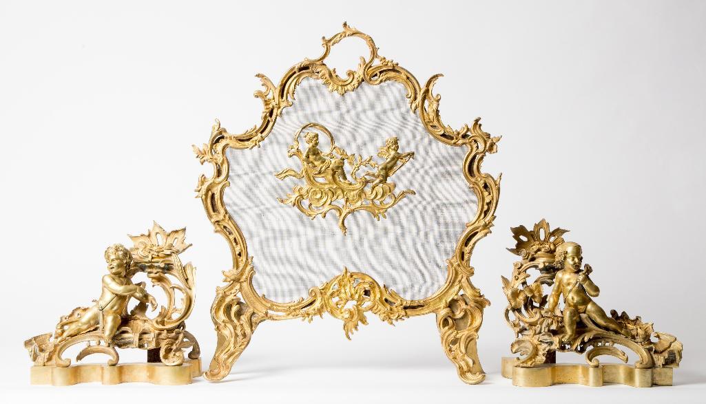 Appraisal: A FRENCH GILT BRONZE FIREPLACE SCREEN AND CHENETS Rococo style