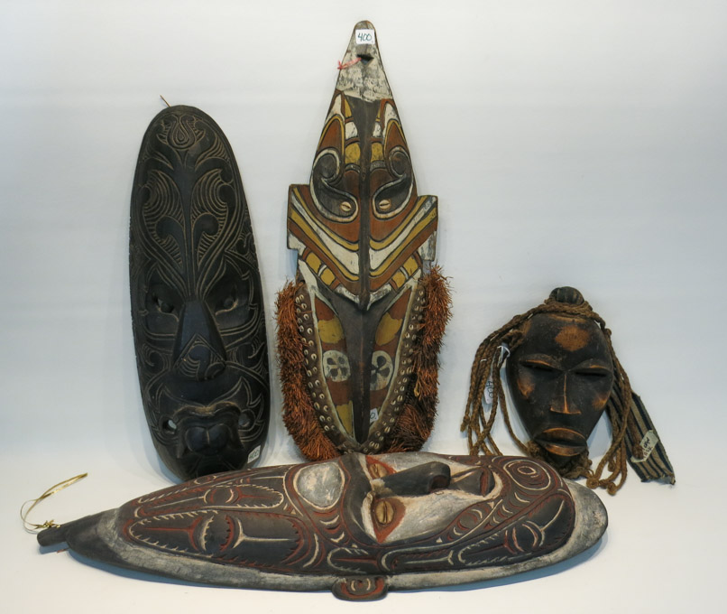 Appraisal: FOUR AFRICAN WOOD CARVED MASKS of human and animal form