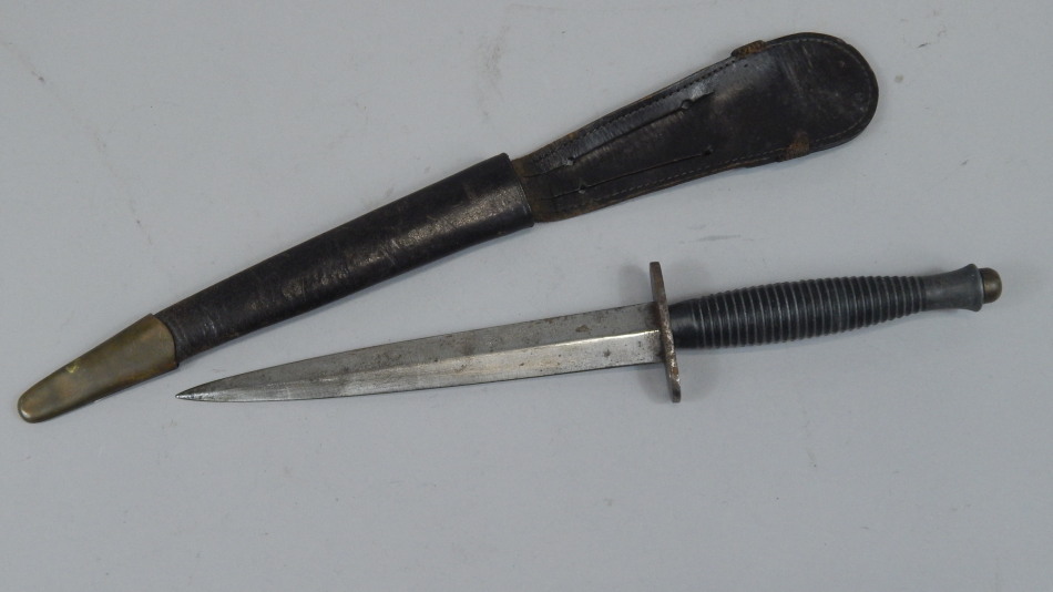 Appraisal: An F Sykes Commando knife with shaped steel handle and