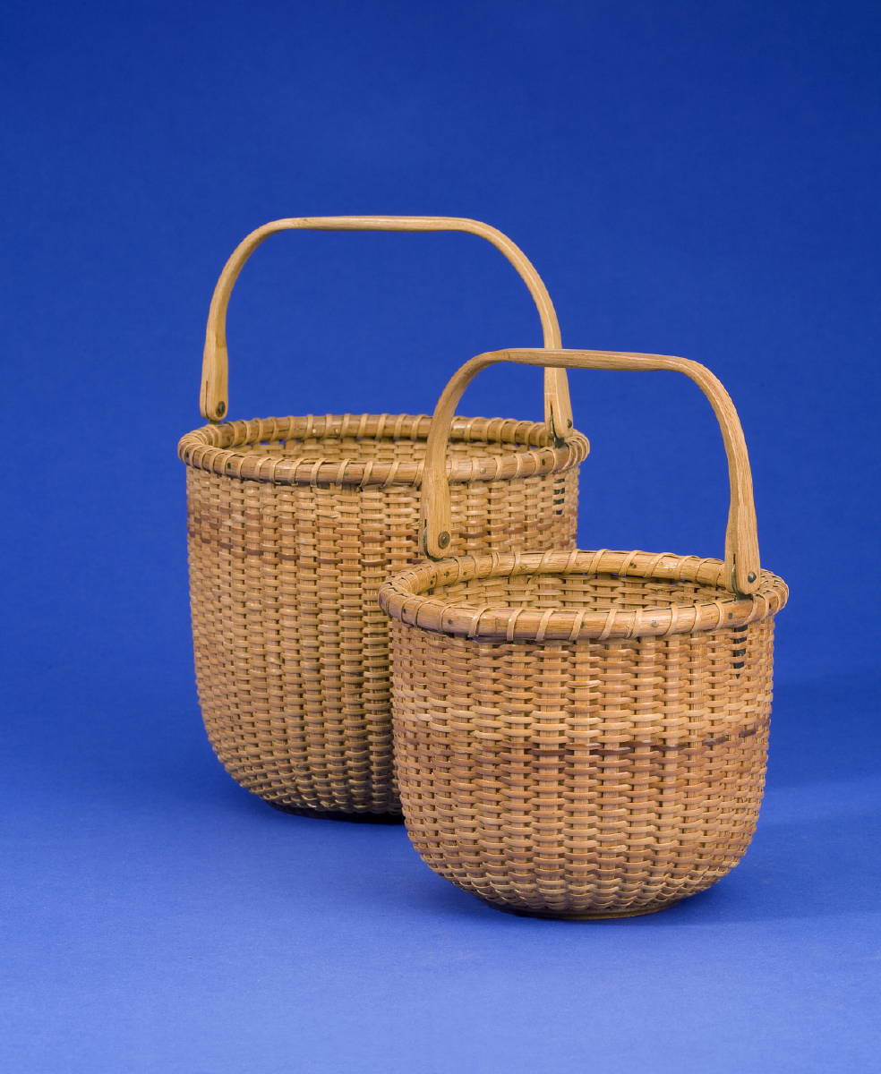 Appraisal: TWO NANTUCKET LIGHTSHIP BASKETS OF CIRCULAR FORM EACH WITH SWING