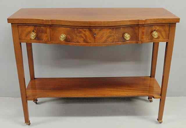 Appraisal: Hepplewhite style mahogany serpentine front server with three drawers square