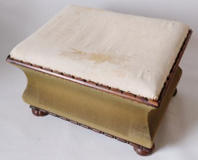 Appraisal: A Regency waisted ottoman with clawed bun feet and carved