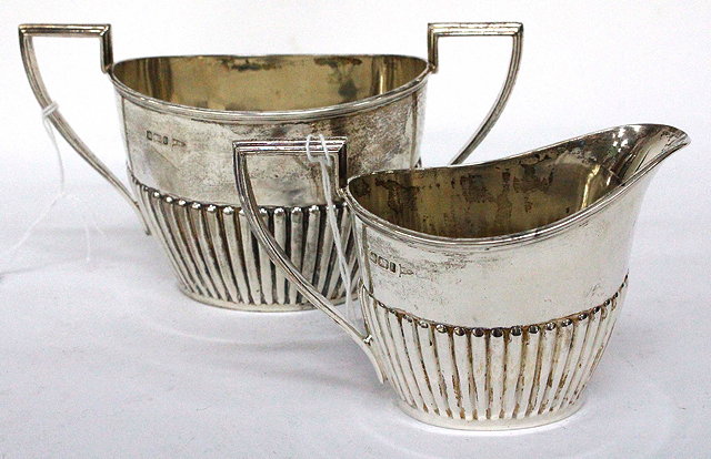 Appraisal: A SHEFFIELD SILVER MILK JUG AND SUGAR BASIN by Walker