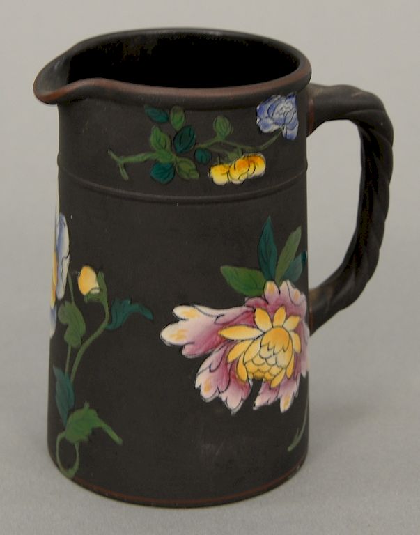 Appraisal: Wedgwood black basalt creamer with enameled flowers ht in Wedgwood