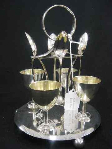 Appraisal: Harrods English Silverplate Egg Set center handle egg cups and