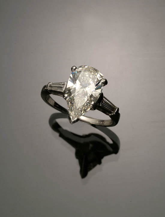 Appraisal: Platinum Solitaire Diamond Ring Set with a pear-cut diamond weighing