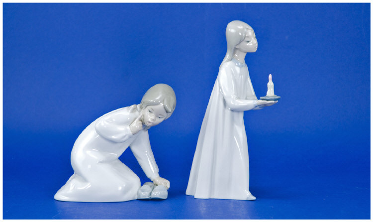 Appraisal: Two Lladro Figures The first of a young girl in