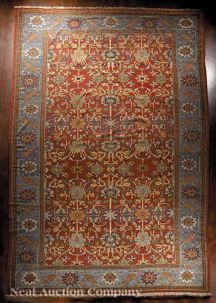 Appraisal: A Persian Sultanabad Carpet red central field blue border with