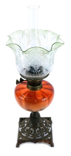 Appraisal: A Victorian oil lamp with a cranberry glass reservoir and