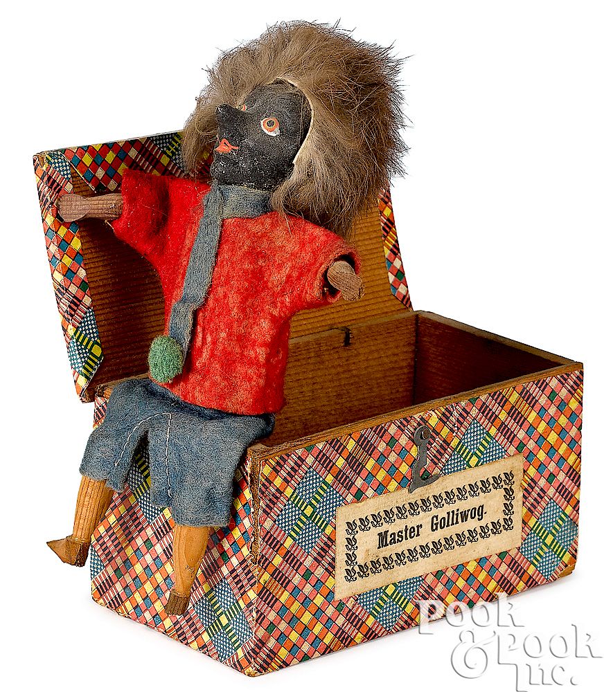 Appraisal: Master Golliwog Jack-in-the-box squeak toy Master Golliwog composition Jack-in-the-box squeak