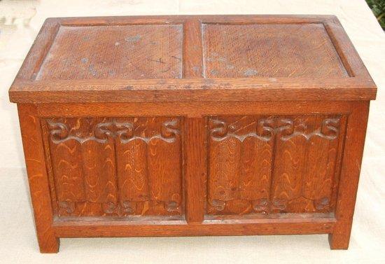 Appraisal: A candle box in oak with linen fold panels possibly