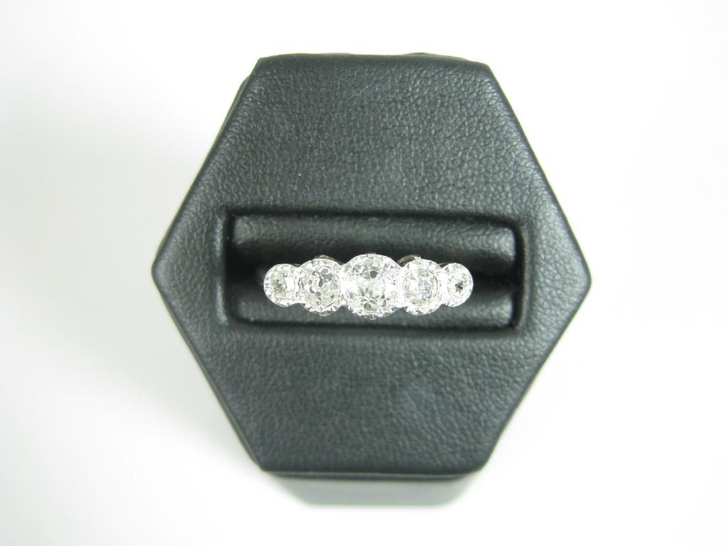 Appraisal: A five stone Diamond Ring the graduated old-cut stones illusion-set