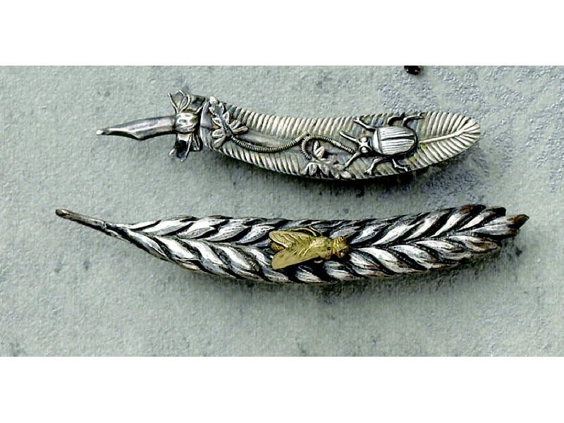 Appraisal: ANTIQUE JAPANESE SILVER AND SHAKUDO FEATHER BROOCH Two Japanese silver