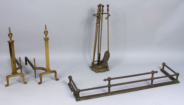 Appraisal: Brass fireplace set including fender andirons and tools h x