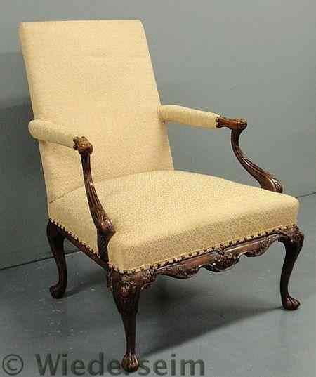 Appraisal: Georgian style carved mahogany open armchair h x w x