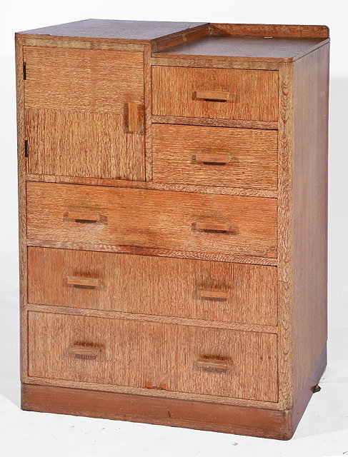 Appraisal: Heals style limed oak chestcirca s with cupboard section and