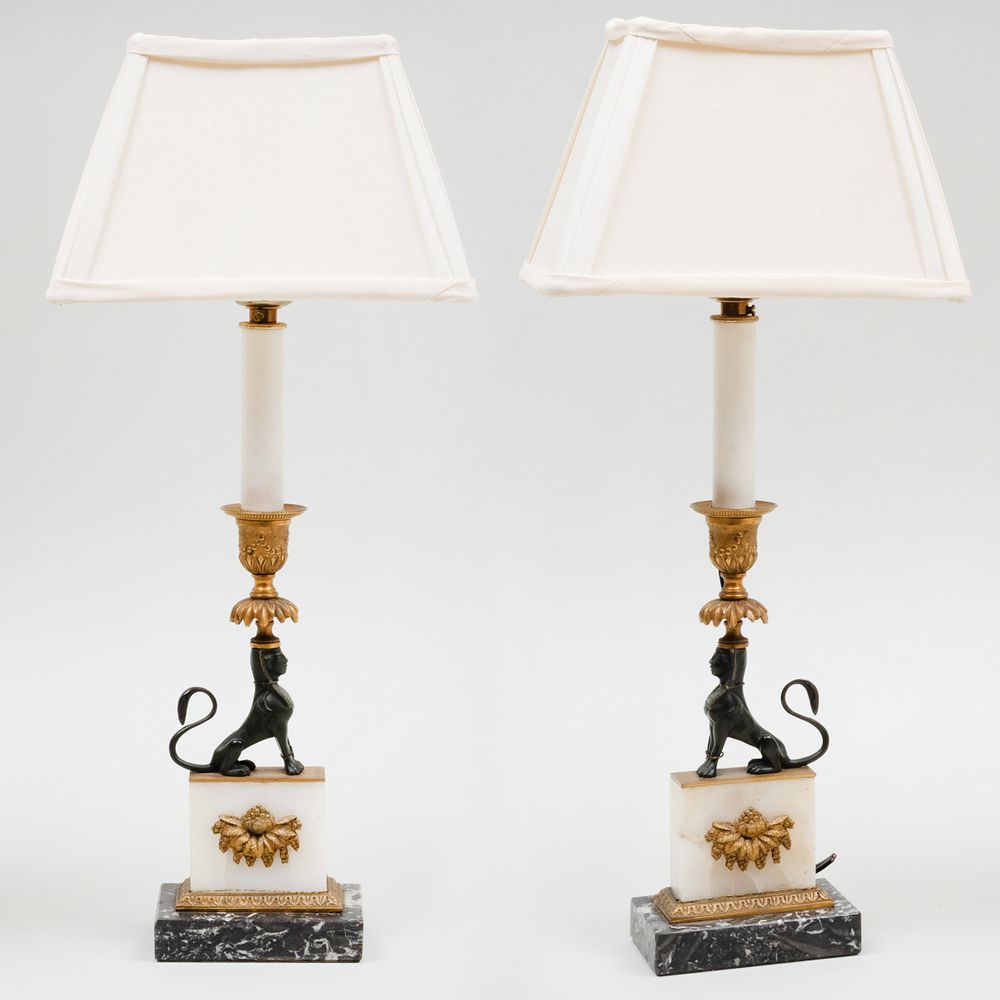 Appraisal: Pair of Marble and Quartz Sphinx Form Candlestick Mounted as