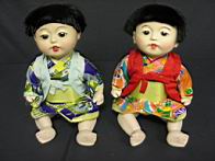 Appraisal: PAIR JAPANESE DOLLS COMPOSITION IN BOX All composition dressed in