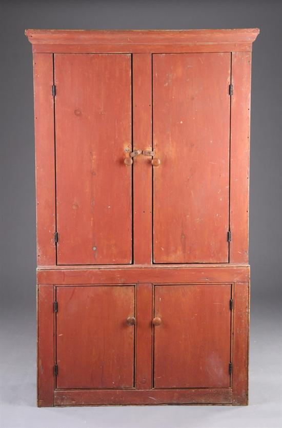 Appraisal: AMERICAN PROVINCIAL STEP-BACK CUPBOARD early th century pine Molded-edge crown