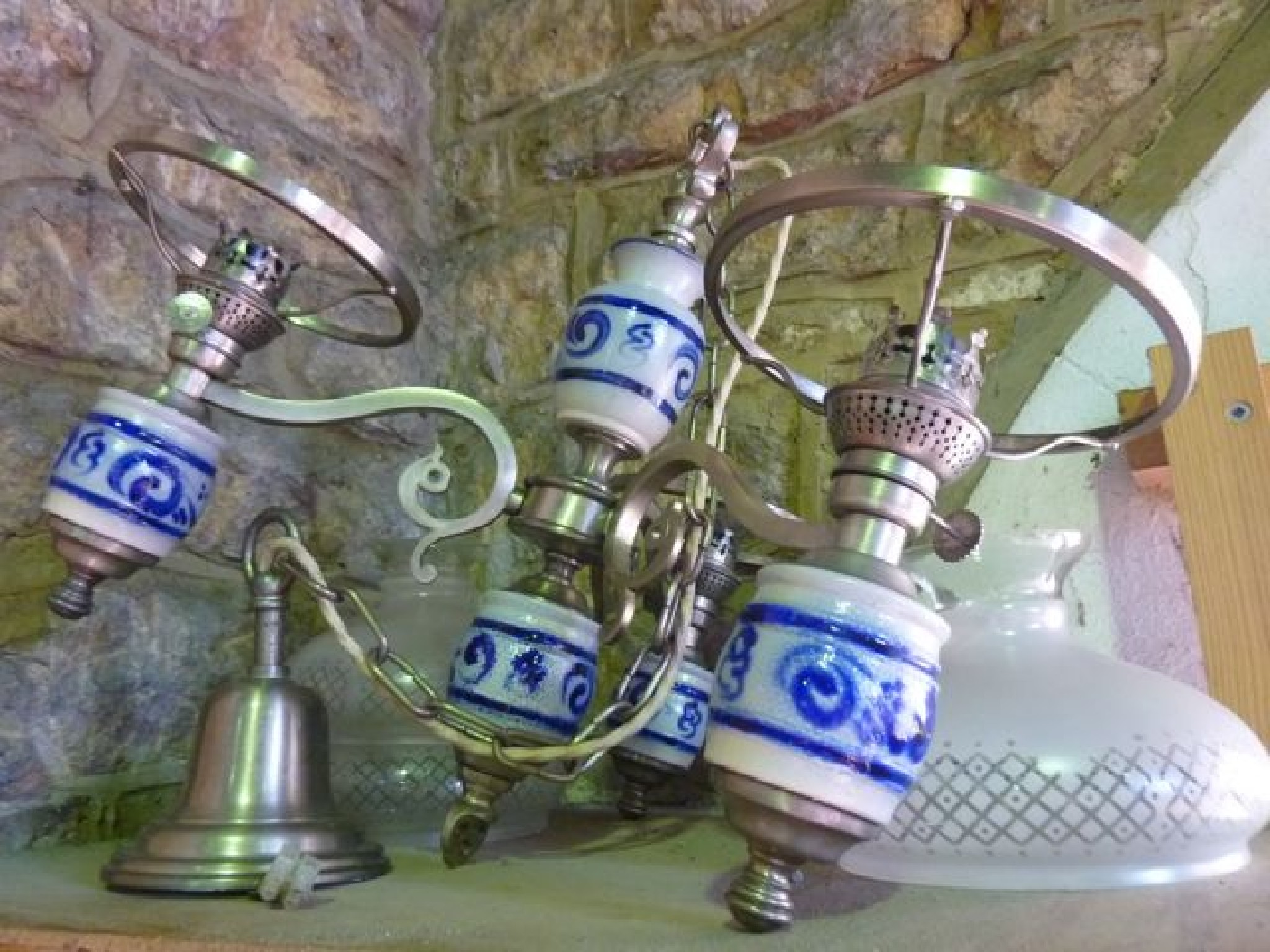 Appraisal: A three divisional electrolier in the form of oil lamp