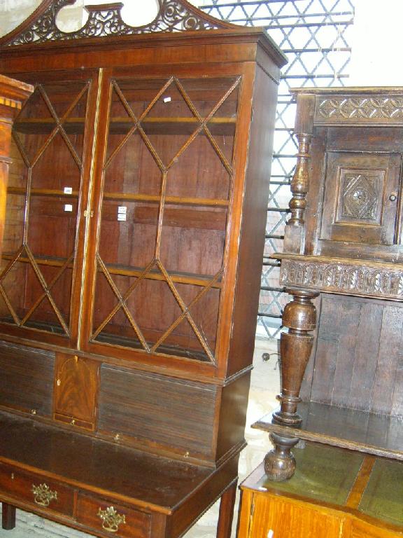 Appraisal: A Georgian mahogany bookcase desk the desk fitted with three