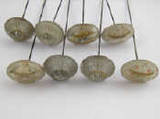 Appraisal: A mixed lot comprising eight hat pins with moulded faux