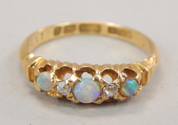 Appraisal: A Victorian opal and diamond dress ring set with three