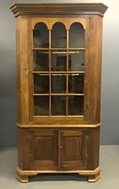 Appraisal: Cherry Two-Piece Corner Cupboard Chippendale style cherry two-piece corner cupboard