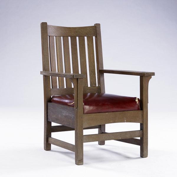 Appraisal: L J G STICKLEY Armchair with slatted back and drop-in