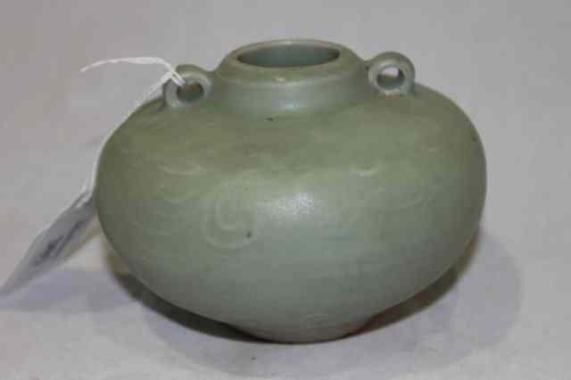 Appraisal: A CHINESE CELADON SMALL VASE with two lappet handles slight