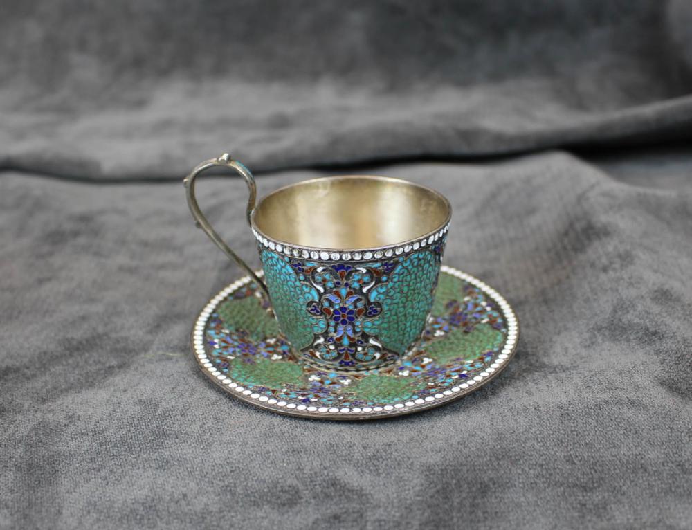 Appraisal: RUSSIAN ENAMELED SILVER TEA CUP AND SAUCER Lev Fridrikhovitch Oleks