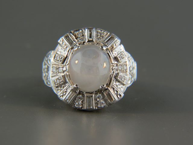 Appraisal: Star Sapphire Diamond Ring elegant silvery grey cabachon gem weighing