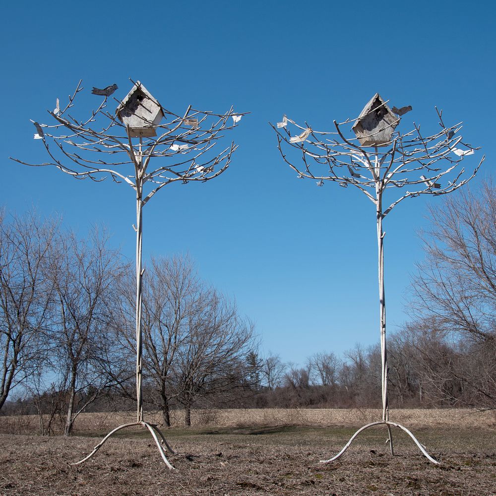 Appraisal: Pair of Painted Metal Trees Surmounted by T le Birdhouses