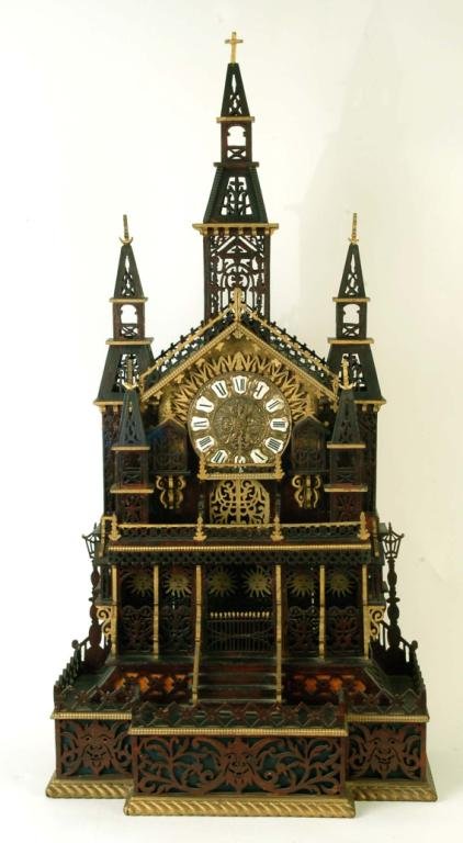 Appraisal: A large Tramp Art fretwork clock in the form of