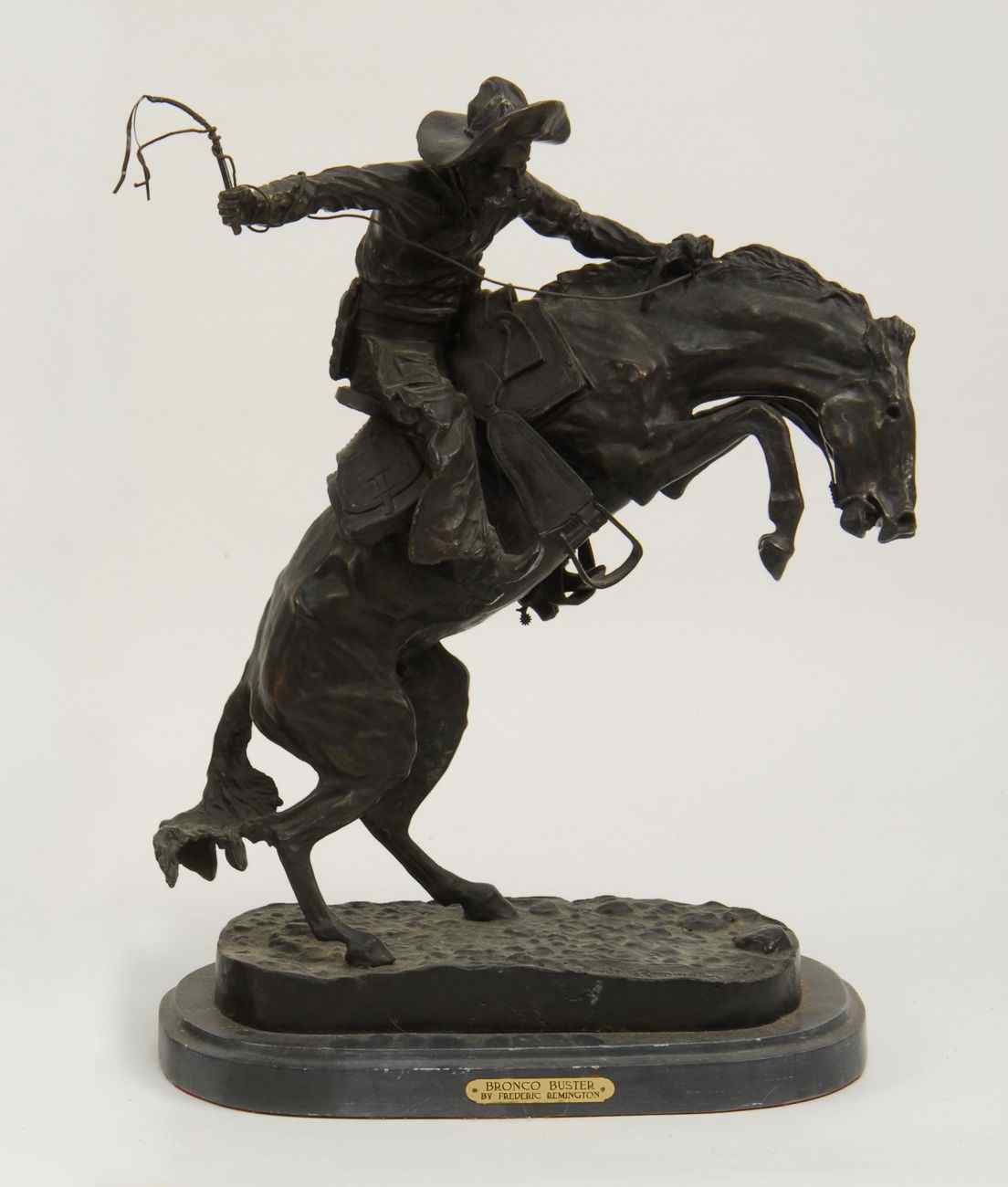 Appraisal: BRONZE SCULPTURE BRONCO BUSTER''After Frederic Remington Marble base Height ''