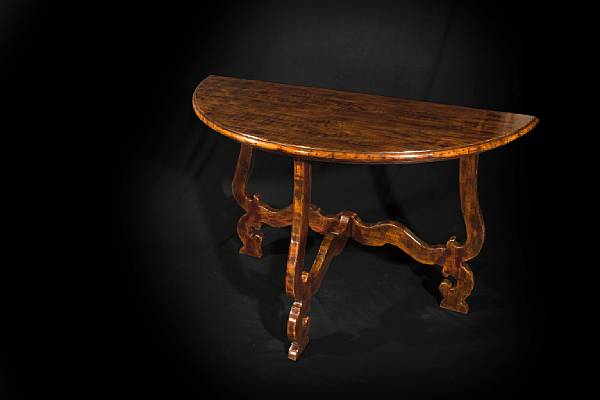 Appraisal: A pair of Italian Baroque style fruitwood demi lune tables